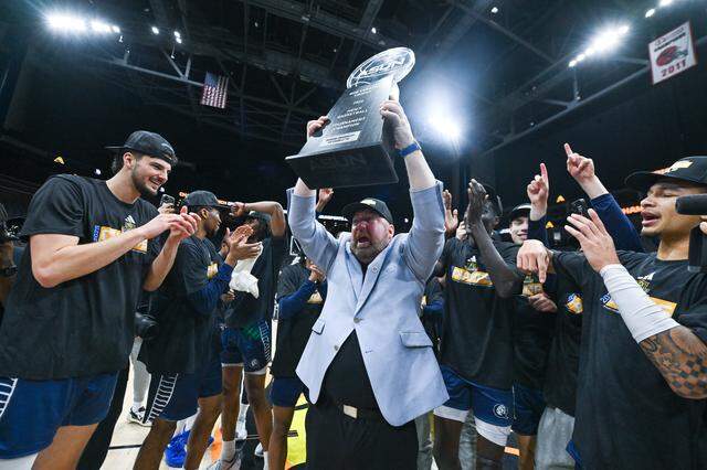 Queens head coach Grant Leonard celebrates after the Royals won the Atlantic Sun championship on Sunday in Jacksonville, Florida. The win over Central Arkansas gave Queens its first berth in the NCAA Tournament.